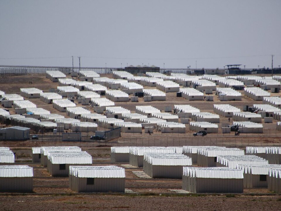 Azraq camp, Jordan, 2017: shelters set out in rows with gaps between them, on bare, gently falling ground.