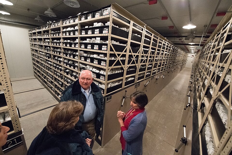 The cold vault of the USDA National Laboratory for Genetic Resources Preservation, Fort Collins, Colorado (2018): seed packets in moisture-proof foil on rolling shelves at −18 °C, nearly 1 million samples of more than 13,200 species.