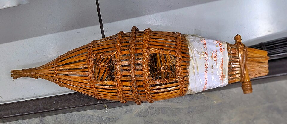 A woven funnel trap — passive gear that works while you sleep.