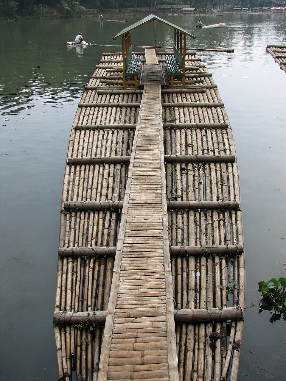 A bamboo raft near Jakarta: bundled culms clamped by cross-poles at intervals along its length, with a walkway down the middle.