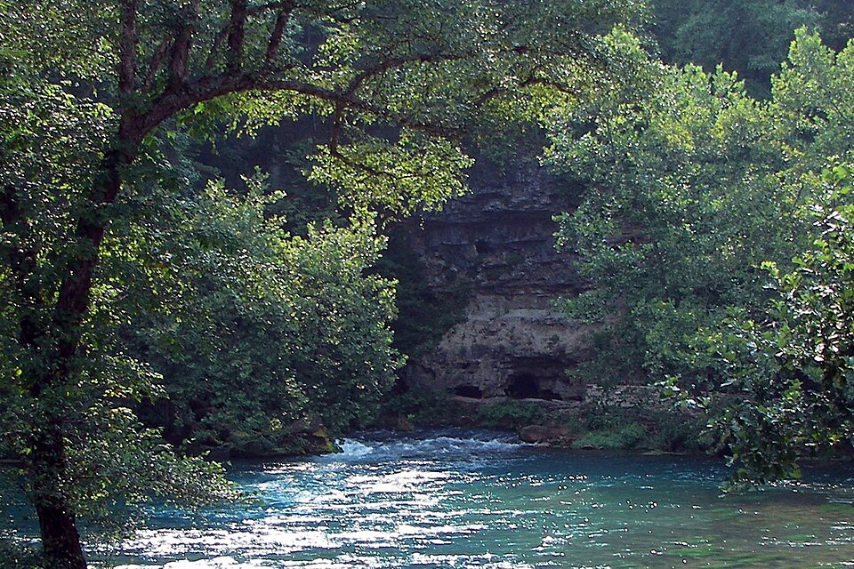 A spring emerging from rock — the best water available without technology.
