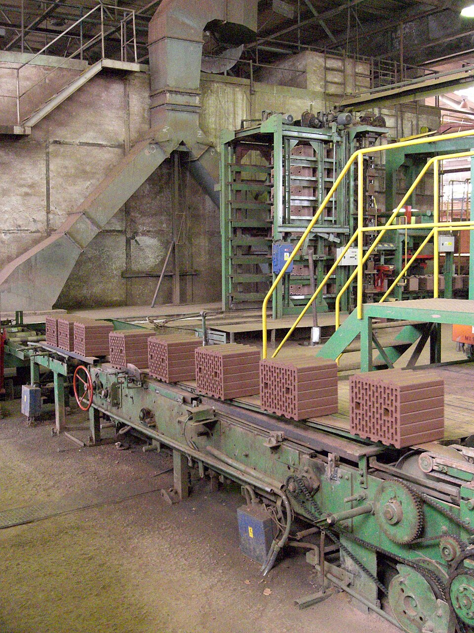 Extruded bricks coming off the line. Standard units make building predictable.