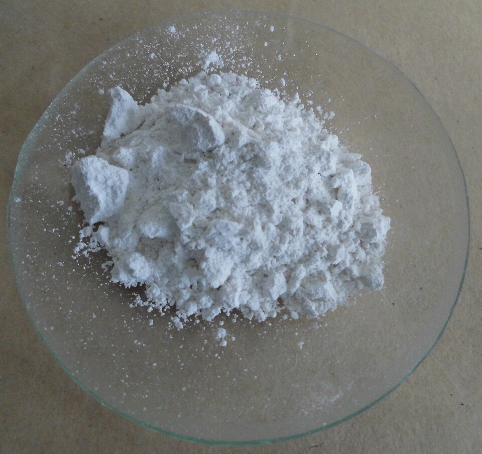 Quicklime — calcium oxide. Caustic on contact with moist skin or eyes, and it heats violently when wetted.