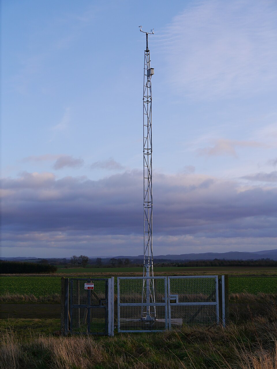 The anemometer and wind vane of the Met Office weather station at Charterhall, Scotland (2012), on an open mast well clear of buildings and trees.