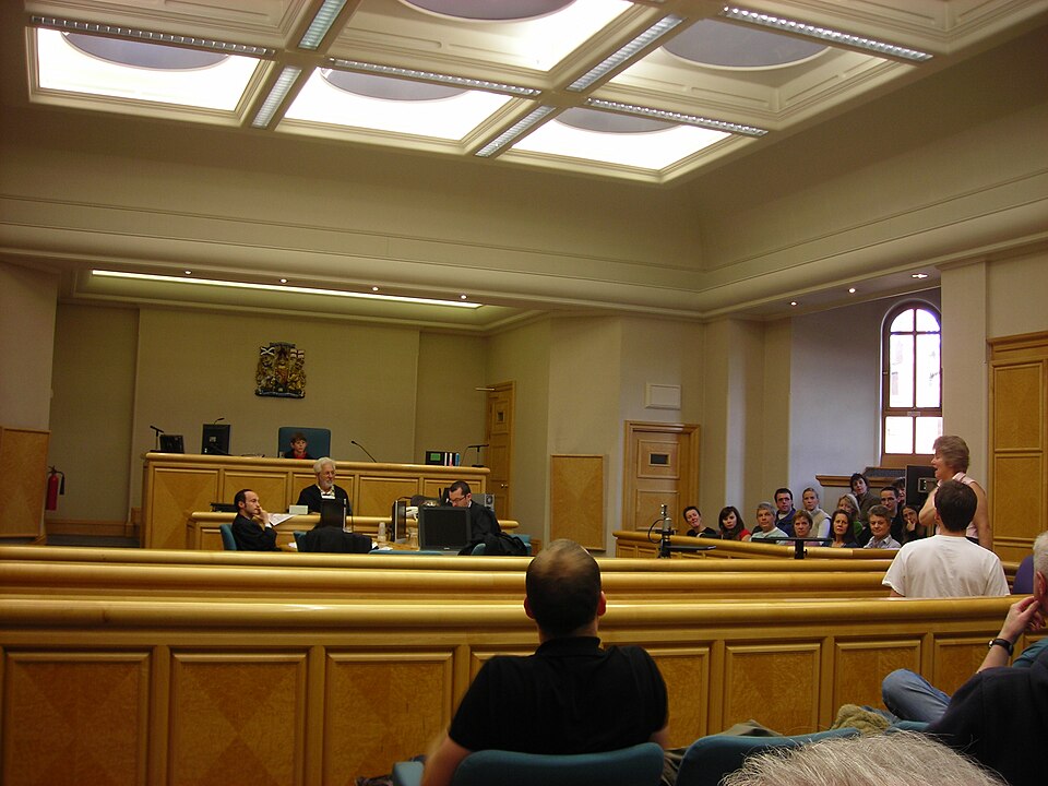 A courtroom in Edinburgh Sheriff Court with the public gallery seated on the right. Open hearings are what let anyone check that the law is applied the same way to everyone.