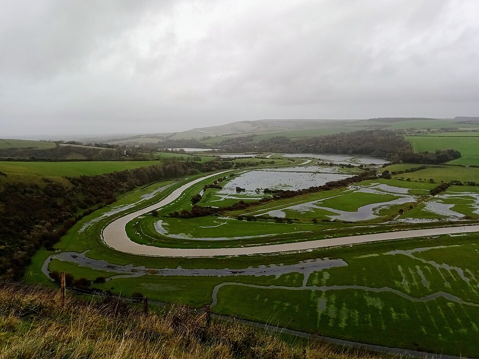 The Cuckmere valley in flood in November 2023, seen from Litlington, Sussex: the river has spread across its functional floodplain, which is kept free of buildings.