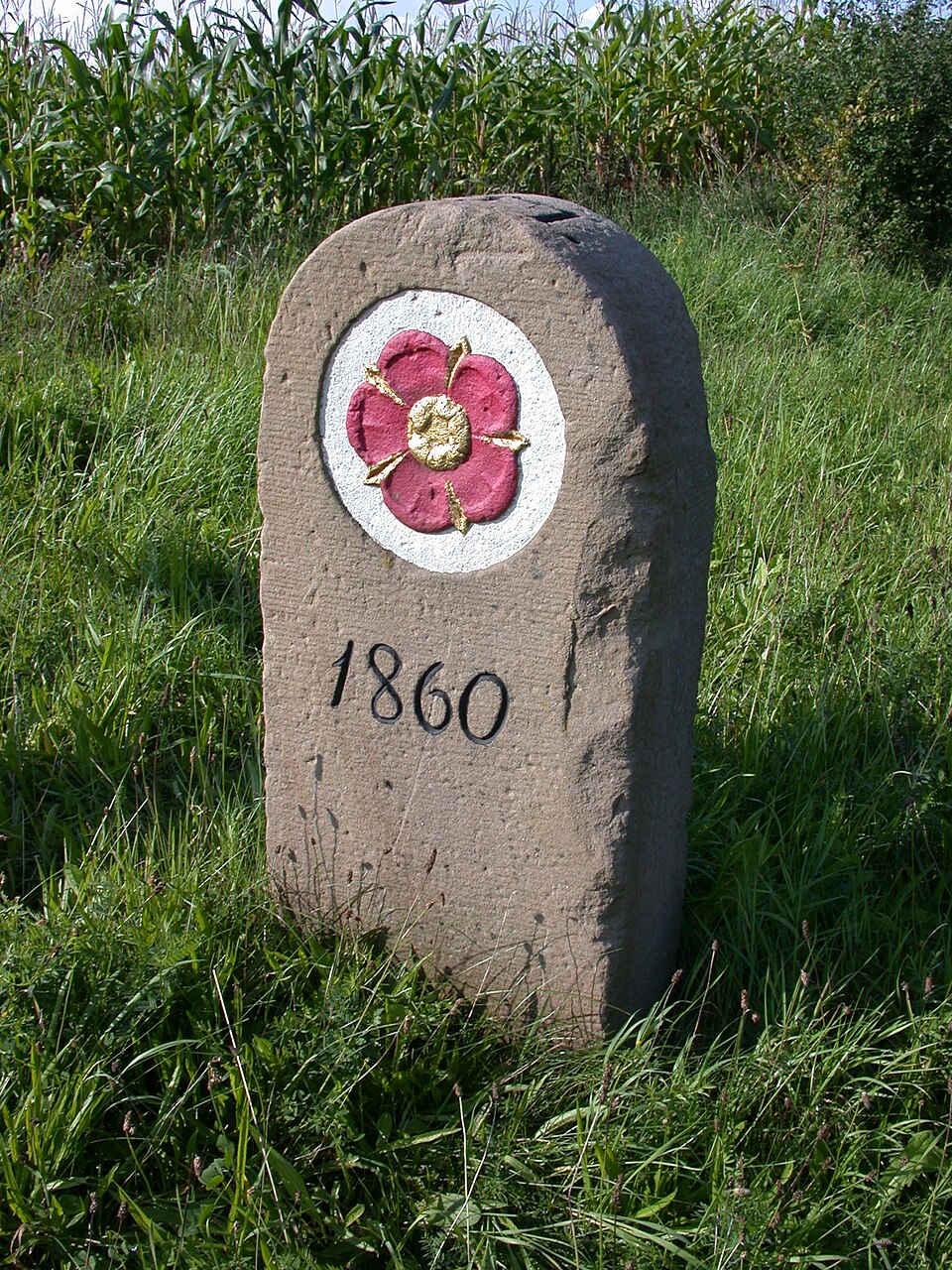 An 1860 boundary stone. A border everyone can see is a quarrel that does not happen.