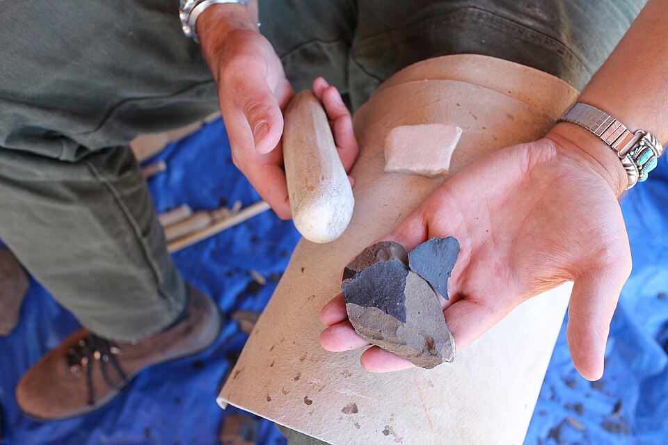 Struck flint flakes and a hammerstone. The first tool that makes other tools.