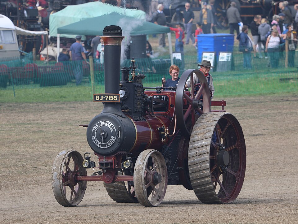 A traction engine under steam — power that goes where the water and coal do.
