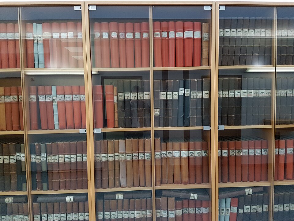 Old land-register volumes for four parishes, kept by the district court at Feldkirch, Austria, which now keeps the register electronically. Each property has its own entry: the parcel, the owner, and every charge on it.