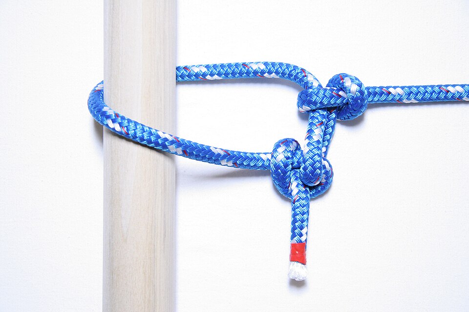 A trucker's hitch: a loop in the standing part acts as a pulley, roughly doubling the pull to tension a load or a ridgeline.