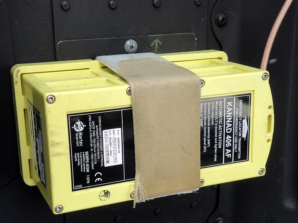 A 406 MHz distress beacon in its mounting: when it starts, satellites relay its alarm and position to a rescue centre.