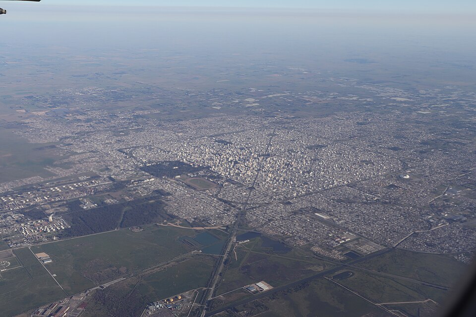 La Plata, Argentina, from the air (2019): a planned city whose square grid of blocks and broad avenues was laid out before it was built, with the countryside beyond.