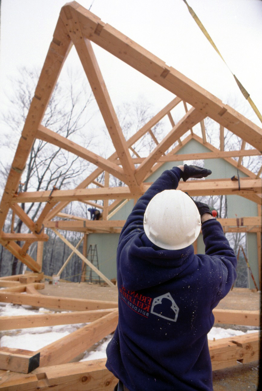 Raising a timber-frame bent, 2008: posts, tie beam, rafters and diagonal knee braces joined flat on the ground, then lifted and stood up as one piece.
