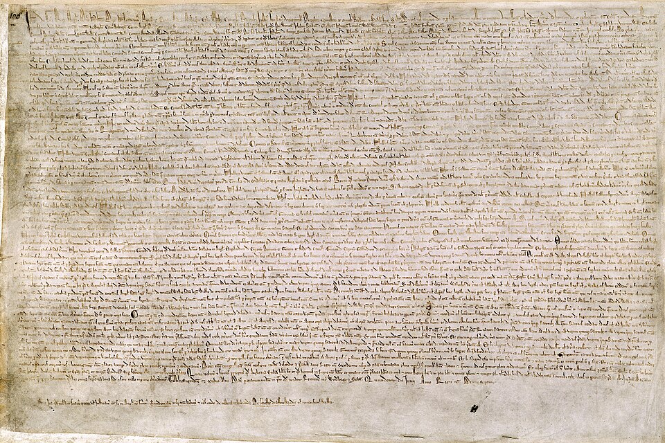 Magna Carta, 1215, one of four surviving originals. Its clause 39 — no free man imprisoned or punished except by the lawful judgment of his peers or by the law of the land — survives, renumbered, in English law today.
