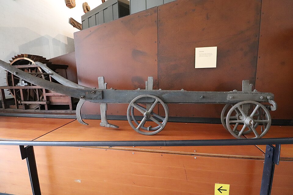 A mole plough (2024): the bullet-shaped foot on its blade is drawn through clay below the surface, leaving a round drainage channel behind it.
