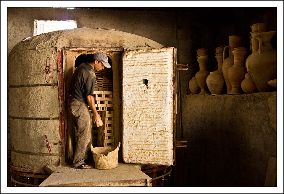 Stacking a kiln in Morocco. How the ware is packed decides how evenly it fires.