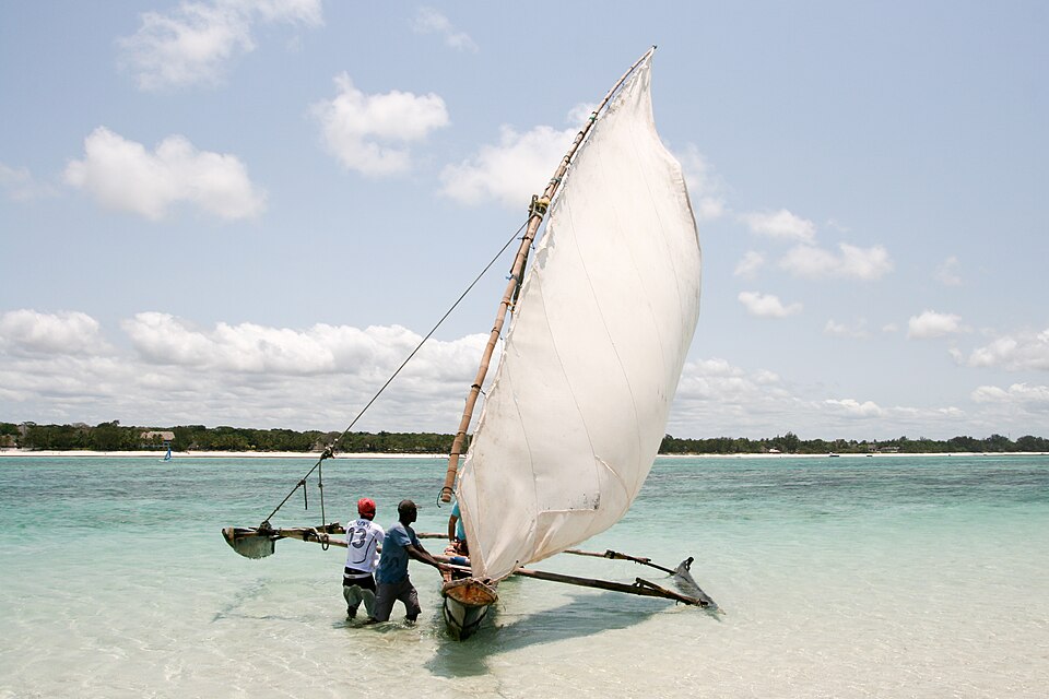 A double-outrigger sailing canoe, Kenya. The two floats on poles either side turn a narrow, tippy hull into a stable boat that can carry a sail.