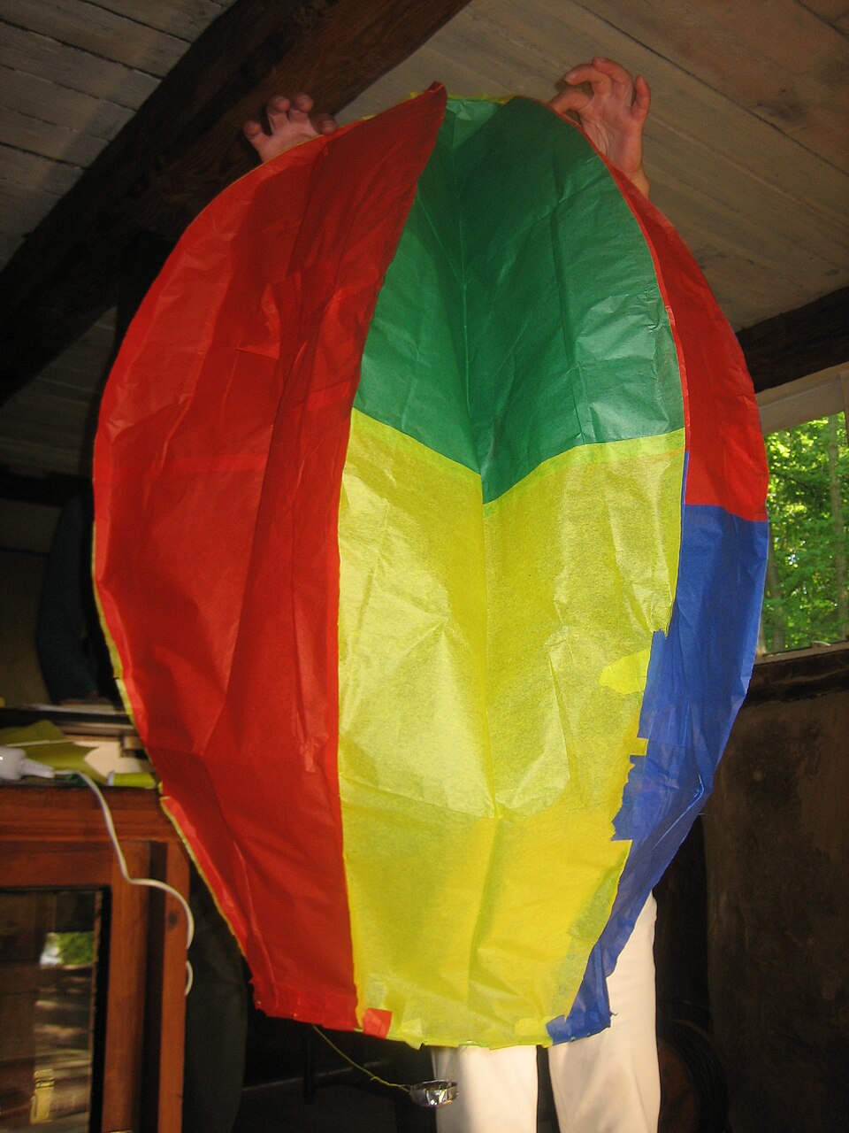 A tissue-paper model balloon held up to show its gores, 2008.