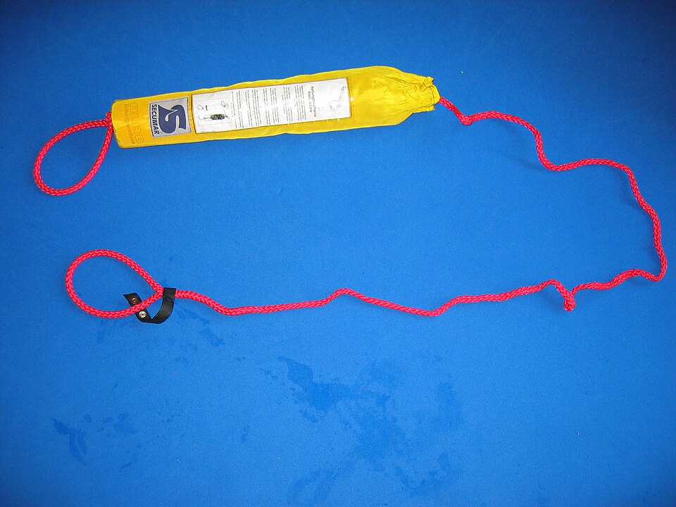 A throw line: a buoyant bag packed with floating rope, and a loop to hold. Throw the bag past the person in the water and pull them in without going in yourself.