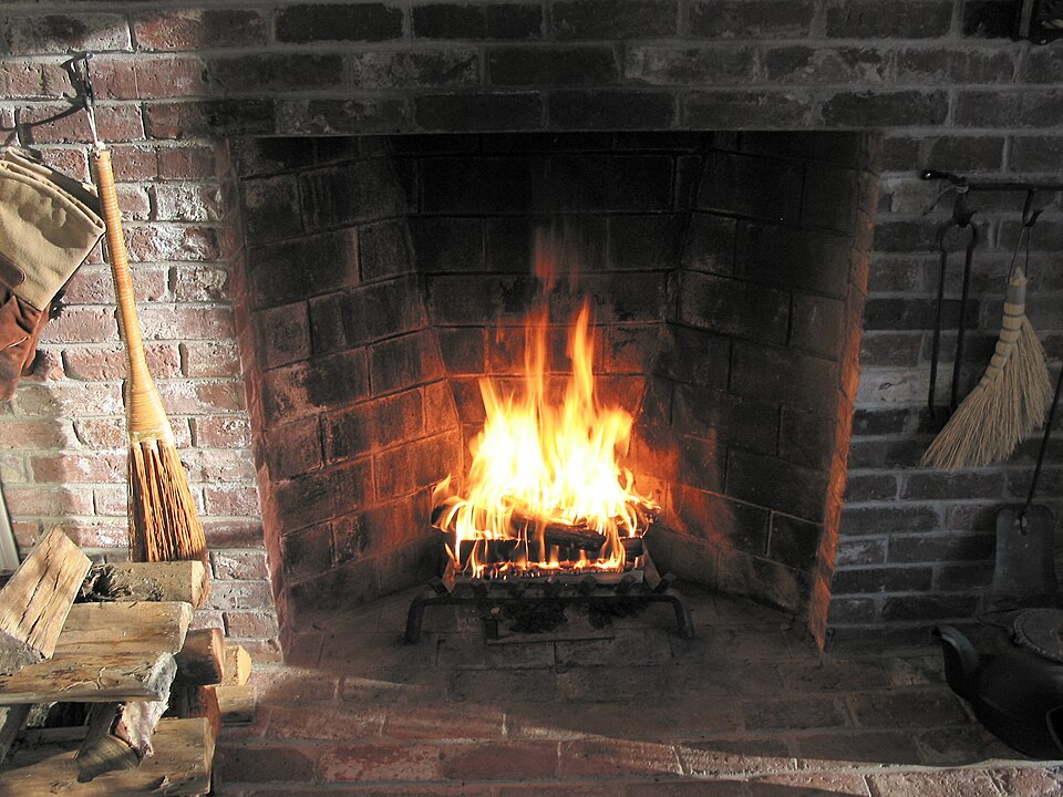 A Rumford fireplace: tall, shallow firebox with sides splayed outward, which throws radiant heat into the room and leads the smoke smoothly into a narrow throat.