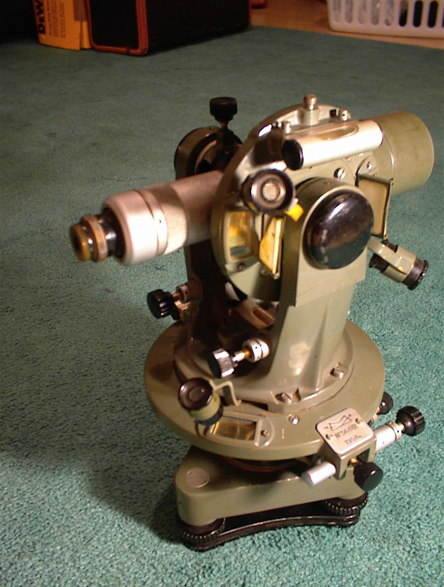 A theodolite. You cannot build to a tolerance you cannot measure.
