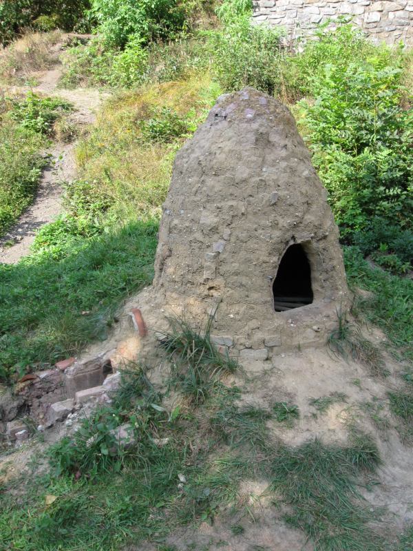An experimental reconstruction of a smelting furnace at Stará huť, Czechia.