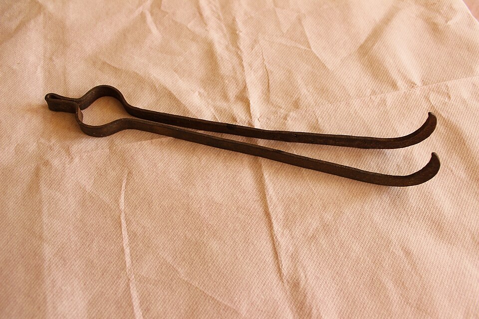 Forged blacksmith's tongs. A smith makes tongs to fit the stock before almost any other tool, because nothing hot can be held without them.