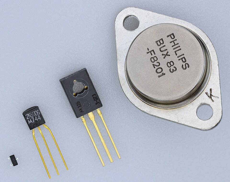 Transistors in common packages, smallest to largest: a surface-mount part, TO-92 (plastic, small-signal), TO-126 (medium power, bolts to a heatsink) and TO-3 (metal can, high power). The package decides how much heat the transistor can shed.