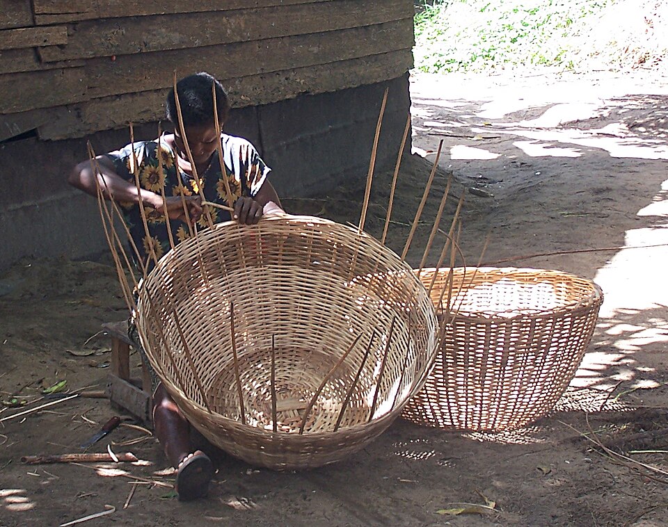 Basket weaving near Lake Ossa, Cameroon. Carrying and storing come before almost everything.
