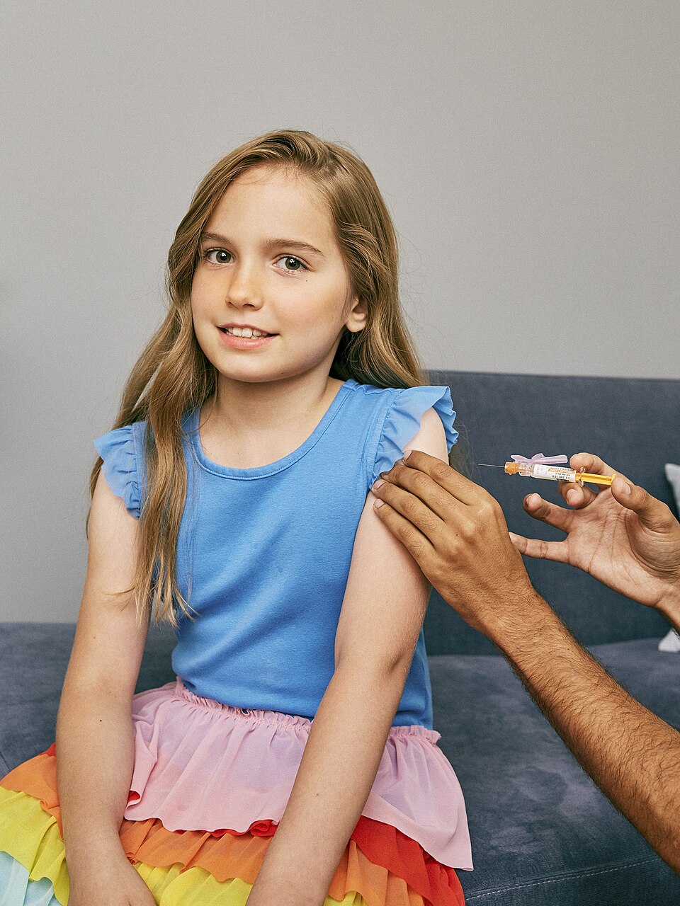 A childhood vaccination. Health becomes a public system rather than a private accident.